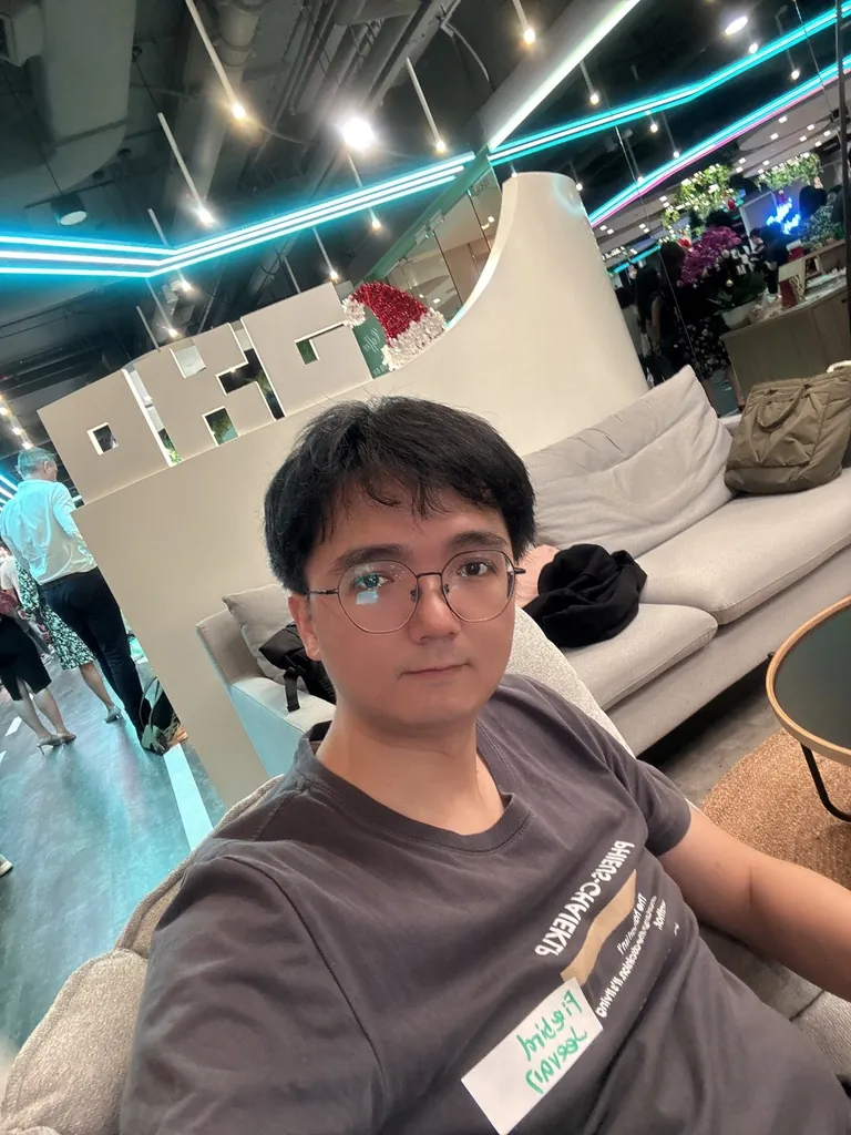 MrNasdog at the OKX office in Singapore, with the OKX logo behind him